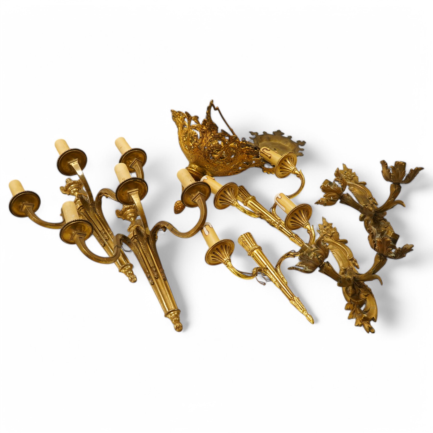 An ormolu ceiling light, a pair of three branch sconces and two pairs of two light sconces, largest 38cm high. Condition - variable